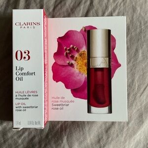 Tiny cherry red Clarins lip oil